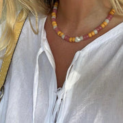 @sarashabacon wearing our hibiscus necklace